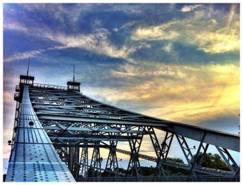 Low angle view of built structure against cloudy sky