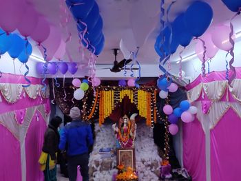 Group of people at colorful balloons