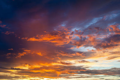 Low angle view of dramatic sky during sunset