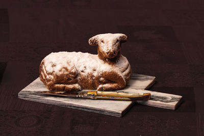 Close-up of bread on cutting board on table