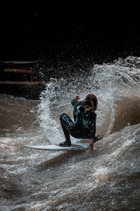 People enjoying splashing water in sea