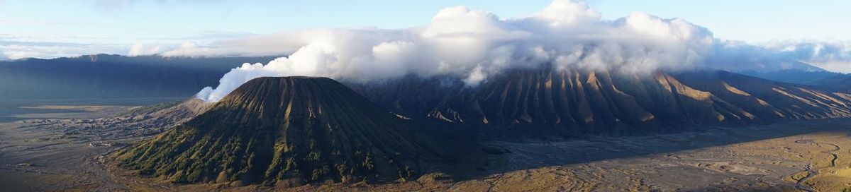 Panoramic view of volcanic landscape against sky