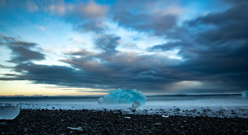 Scenic view of sea against sky during winter