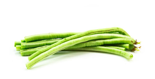 Close-up of green pepper against white background