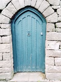 Closed blue door of building