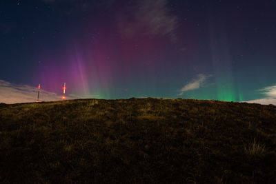 Scenic view of landscape against sky at night