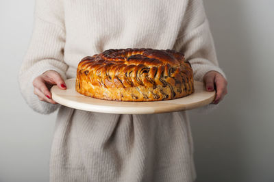 Midsection of woman holding dessert