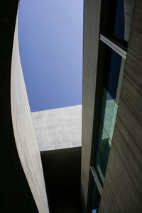 Low angle view of building against blue sky