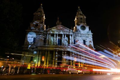 Low angle view of illuminated buildings at night