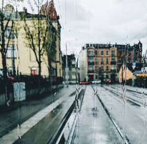 Wet street in city during winter