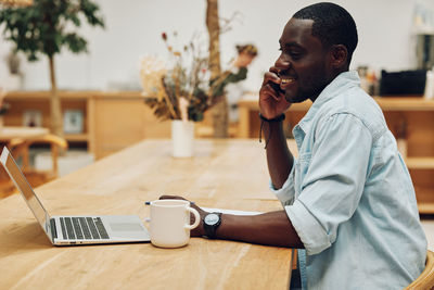 Young man using mobile phone