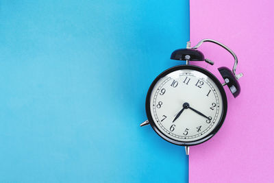 Low angle view of clock on wall