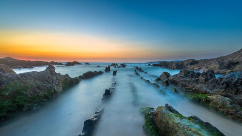 Panoramic view of sea against sky during sunset