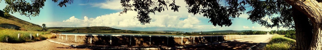 Panoramic view of lake and trees against sky