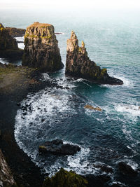 High angle view of rock formations in sea