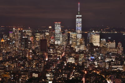 Aerial view of city lit up at night