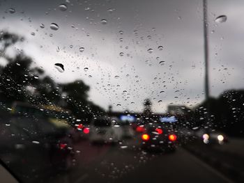 Cars on wet window in rainy season