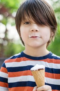 Portrait of boy holding ice cream cone