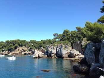 Scenic view of sea against clear blue sky