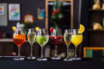 Close-up of wine glasses on table