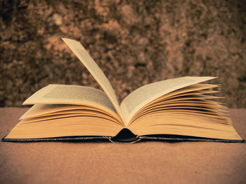 Close-up of open bible on table