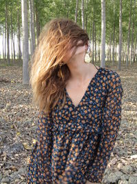 Close-up of woman with long hair in forest