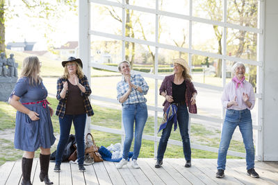 View of happy women dancing together