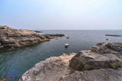 Scenic view of sea against clear sky