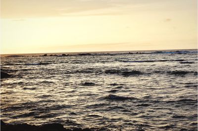 Scenic view of sea against clear sky during sunset