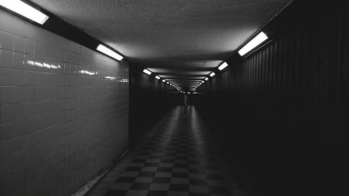 Empty illuminated walkway in building