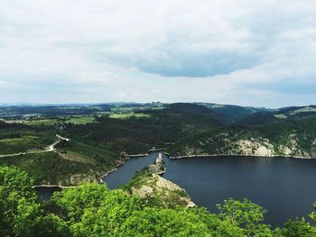 Scenic view of loire river and mountains against cloudy sky