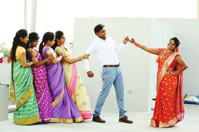 Group of people standing against the wall