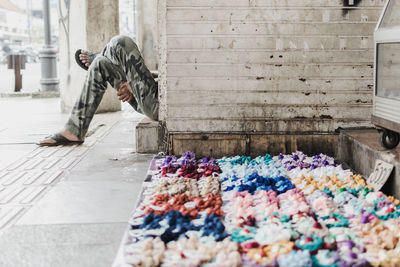 Low section of seller resting with rubber bands in foreground