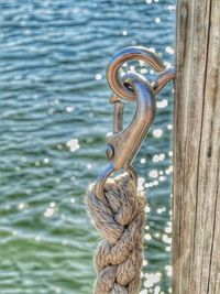 Close-up of chain hanging on rope