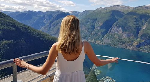 Rear view of woman looking at mountains