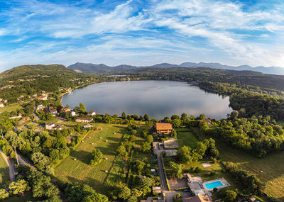 High angle view of townscape by sea against sky