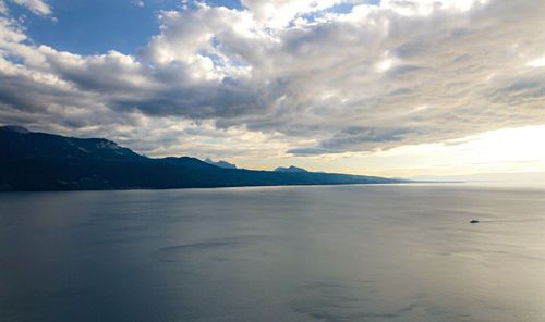 Scenic view of mountains against cloudy sky