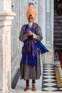 Full length of man with umbrella