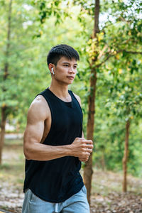 Young man jogging at park
