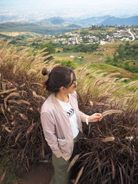 High angle view of woman standing in farm