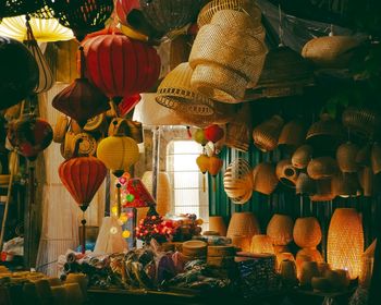 Lanterns hanging in market stall for sale