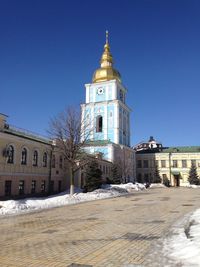 View of building against clear blue sky during winter