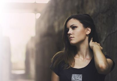 Beautiful young woman looking away