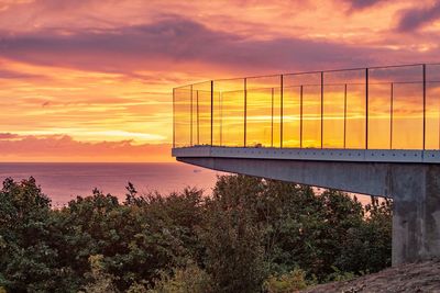 Scenic view of sea against orange sky