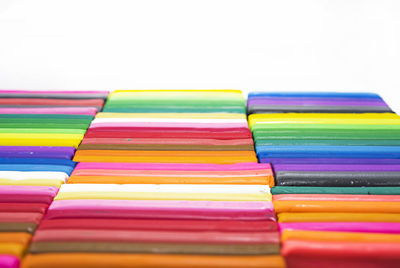 Full frame shot of multi colored pencils against white background