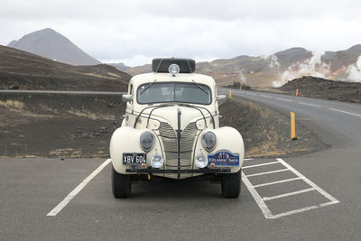 Car on road against mountain range