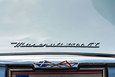 Low angle view of sign against sky