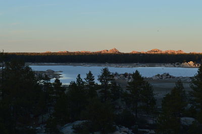 Scenic view of lake against sky during sunset