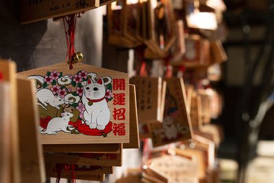 Close-up of hanging for sale in market