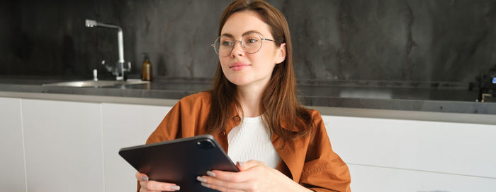 Young woman using digital tablet